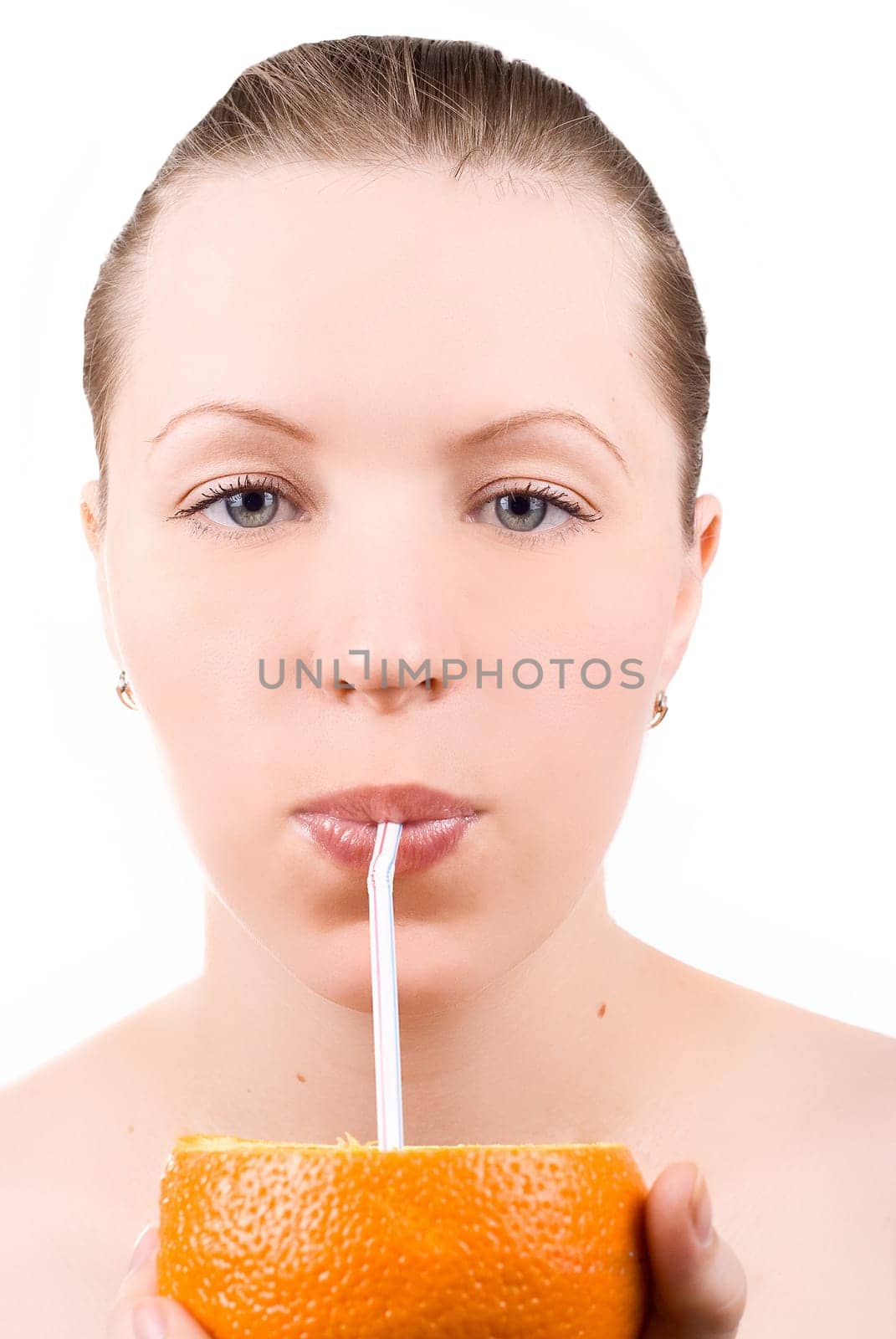 Pretty girl drink orange juice on white