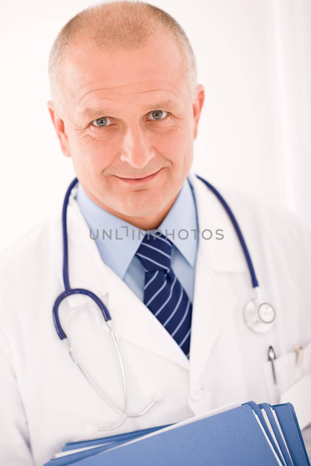 Professional senior doctor male with stethoscope portrait with document folders