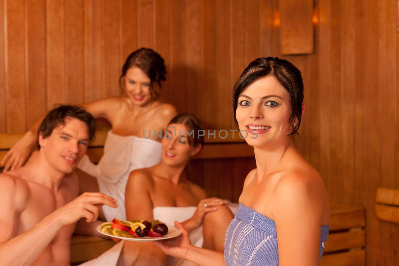 Four people or friends in the sauna
