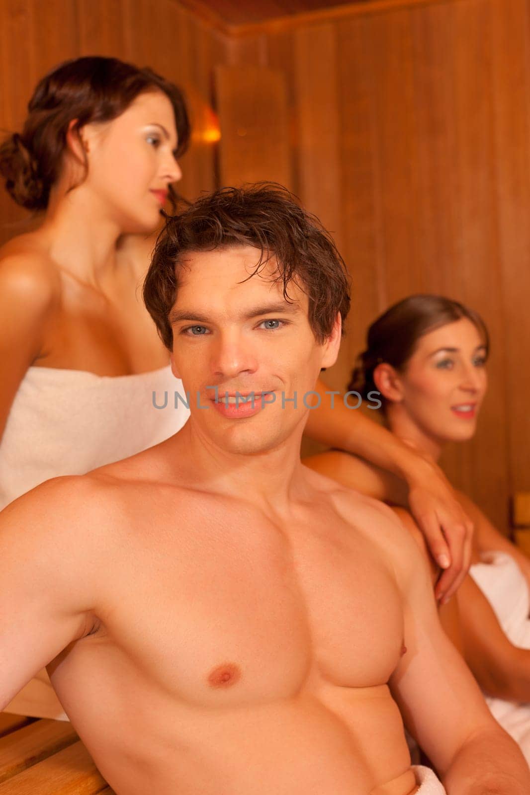 Three people or friends in the sauna
