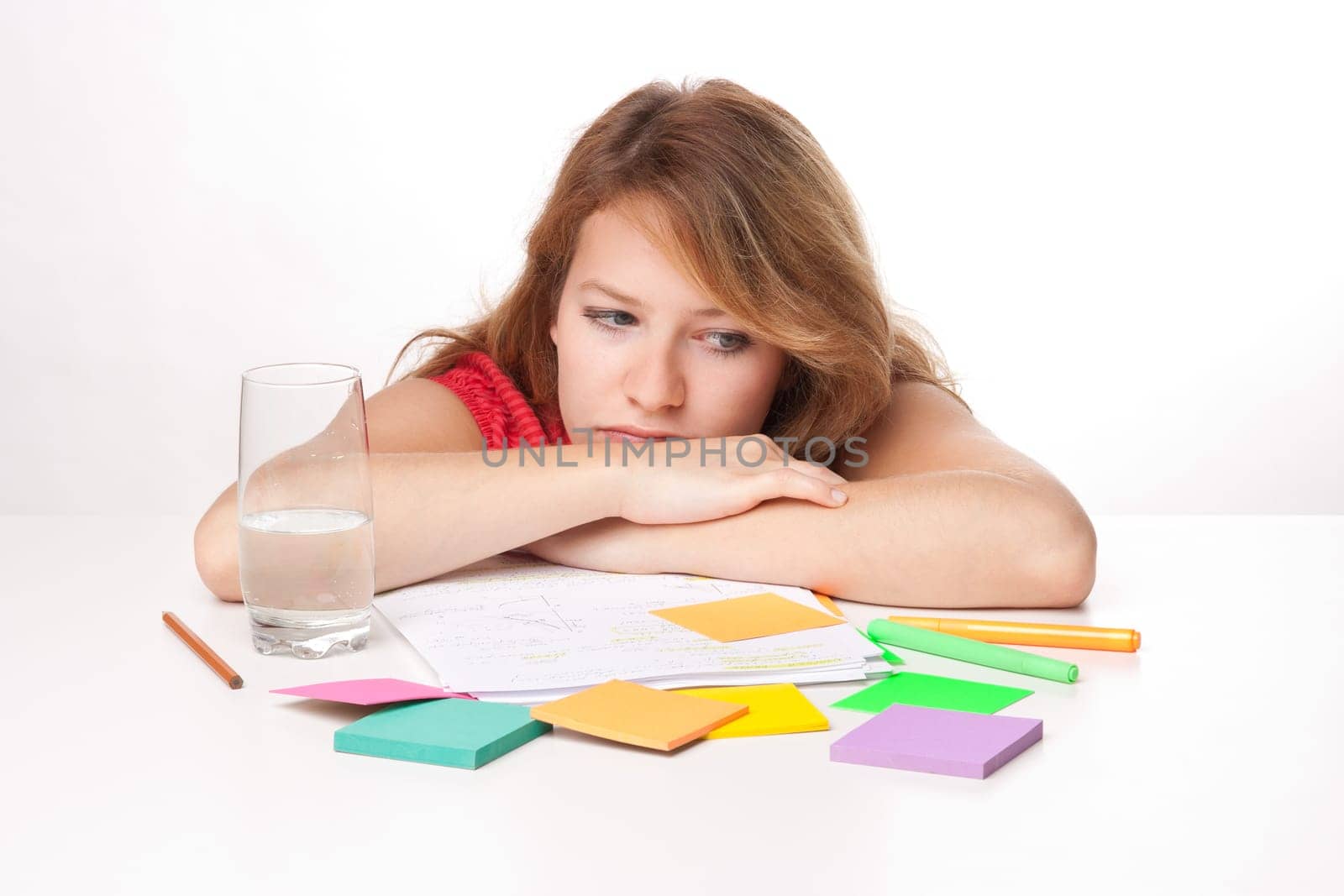 Bored college student is having a rest during studying for exam