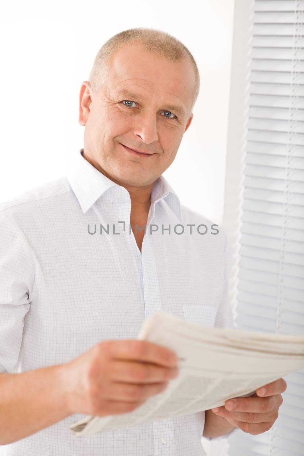 Happy senior businessman professional portrait read newspapers white shirt
