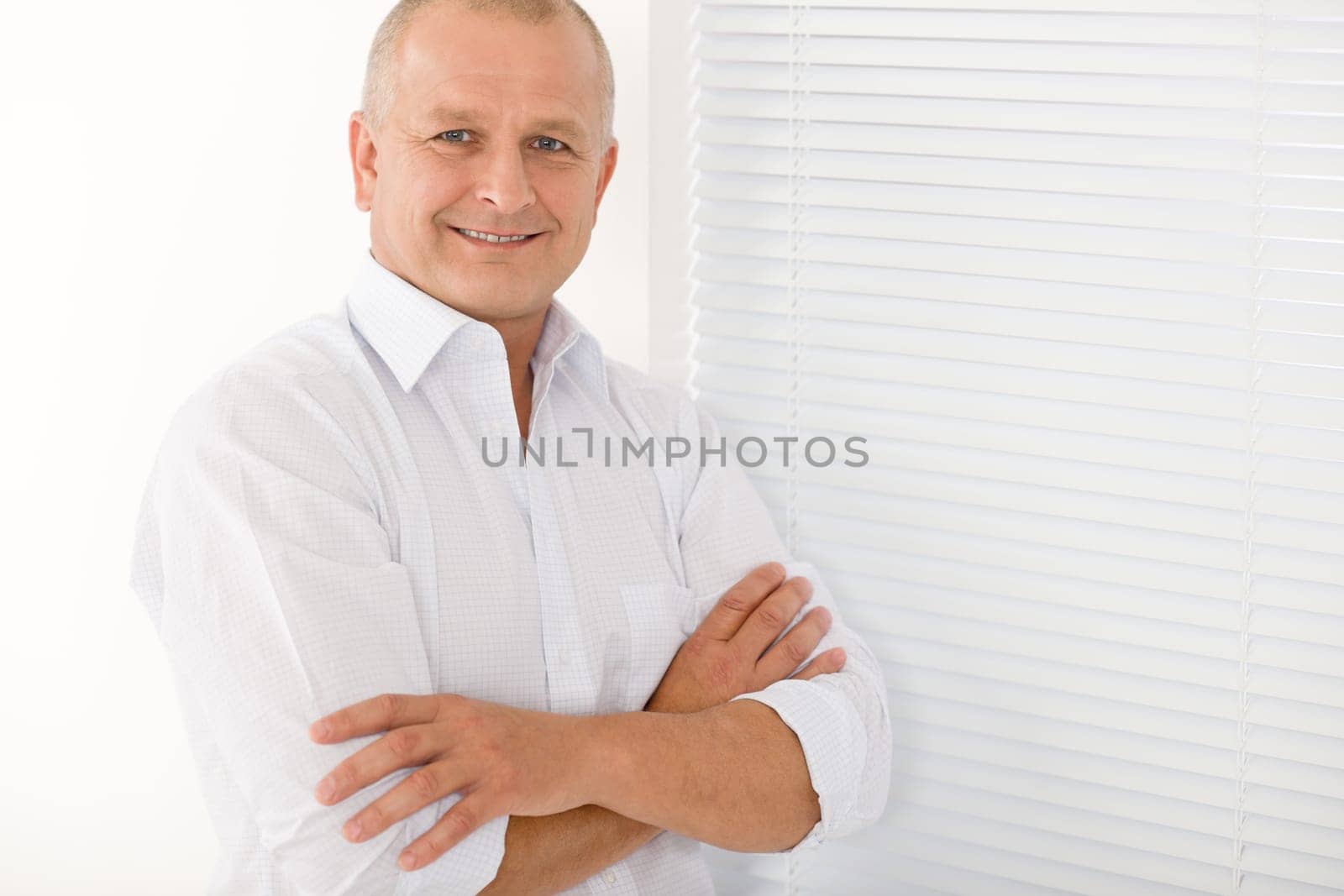 Happy successful mature businessman professional portrait smiling crossed arms