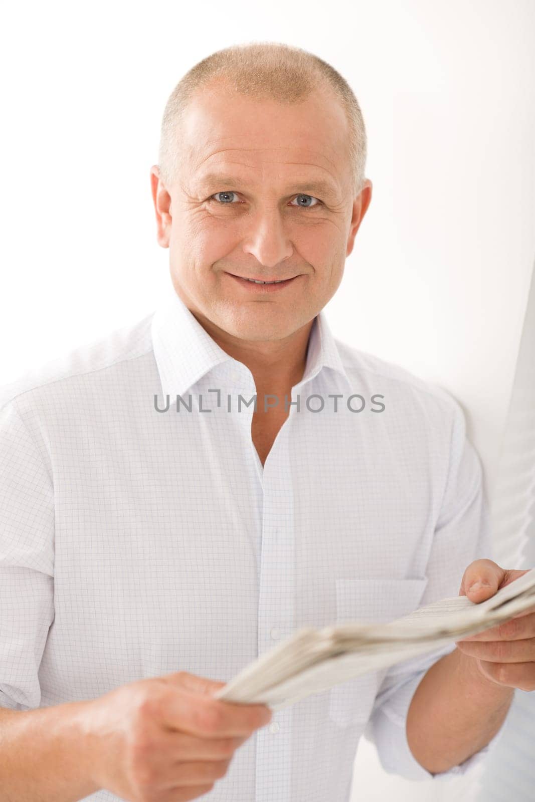Happy senior businessman professional portrait read newspapers white shirt