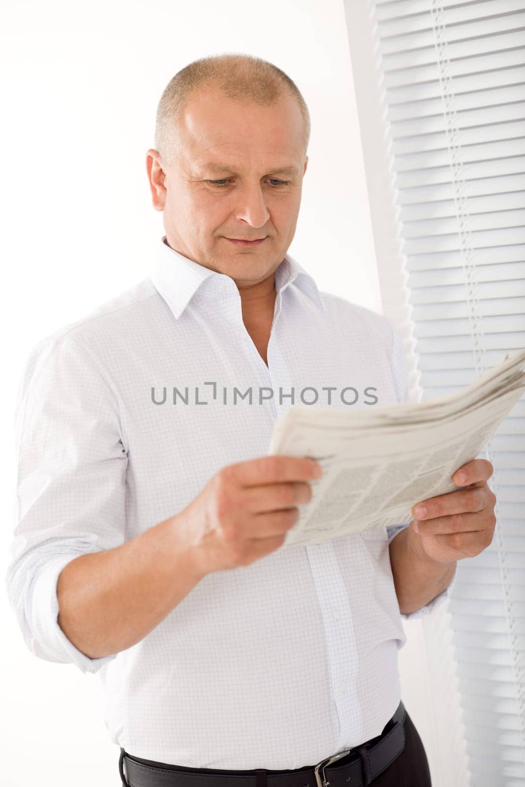 Happy senior businessman professional portrait read newspapers white shirt