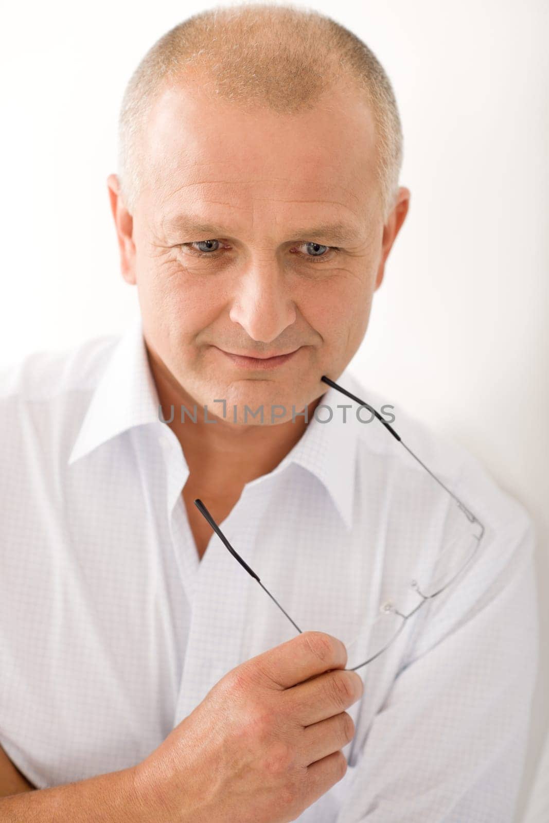 Happy successful mature businessman professional portrait hold glasses