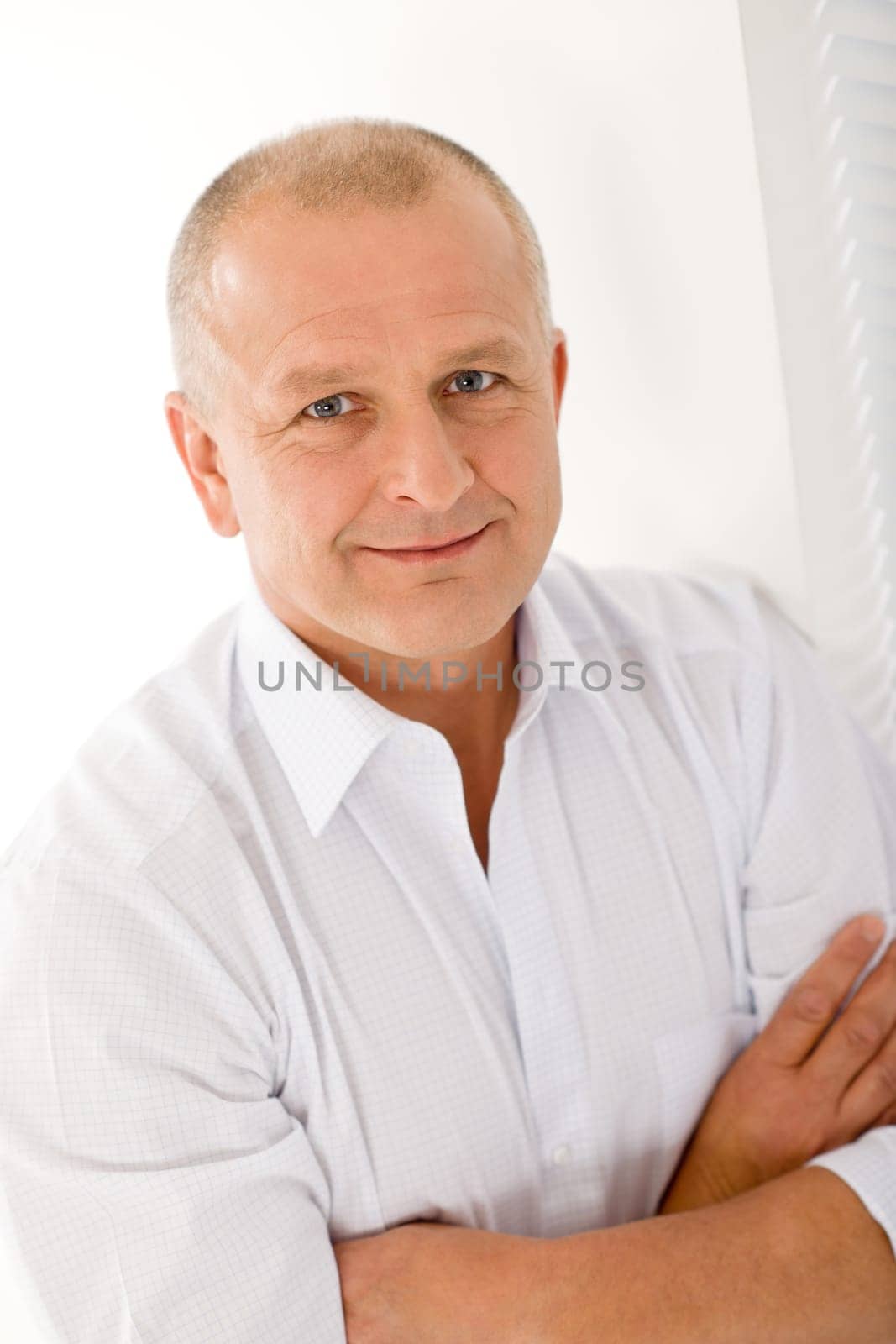 Happy successful mature businessman professional portrait smiling crossed arms
