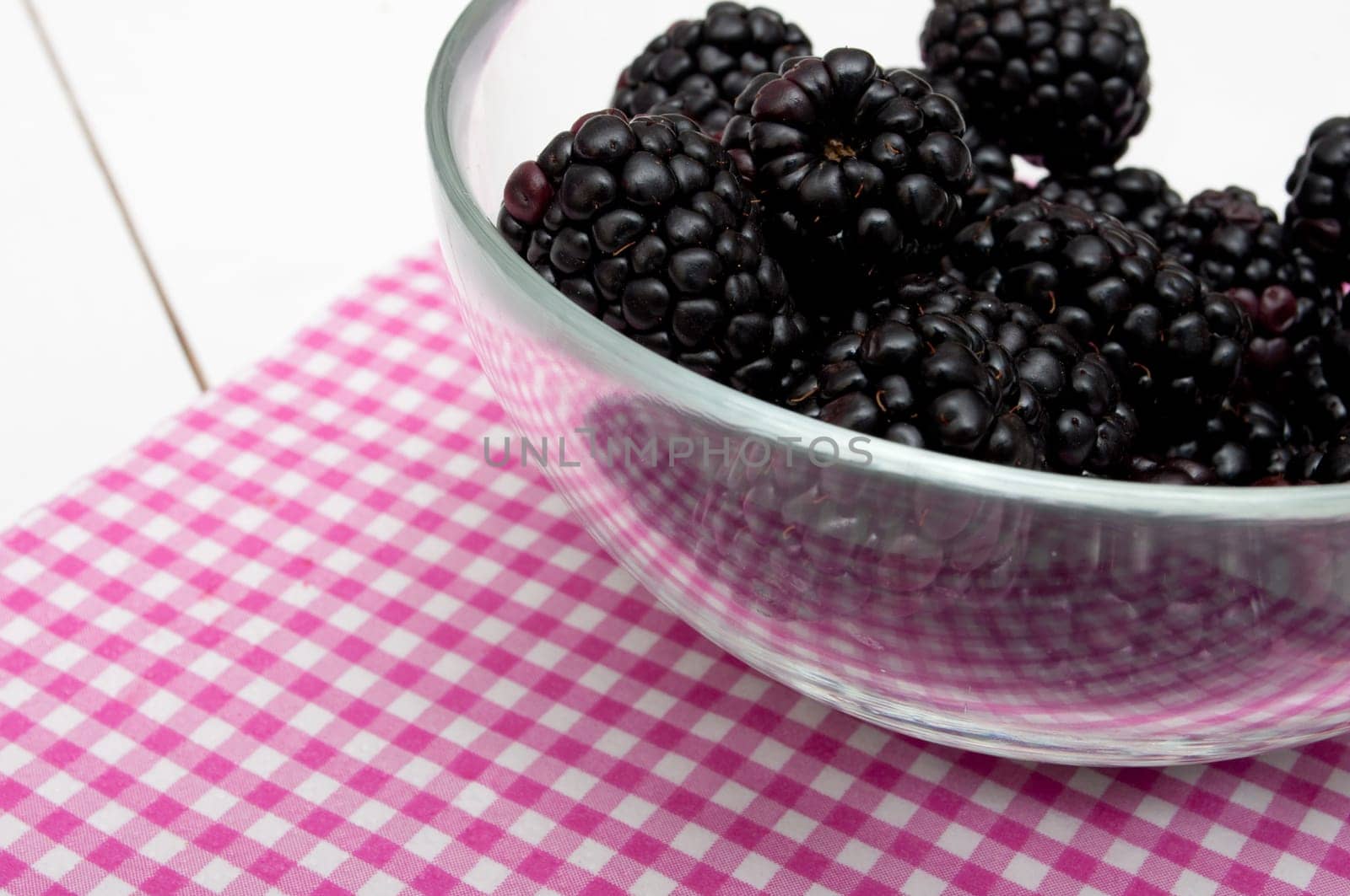 Fresh Blackberries in Glass Bowl on White Table