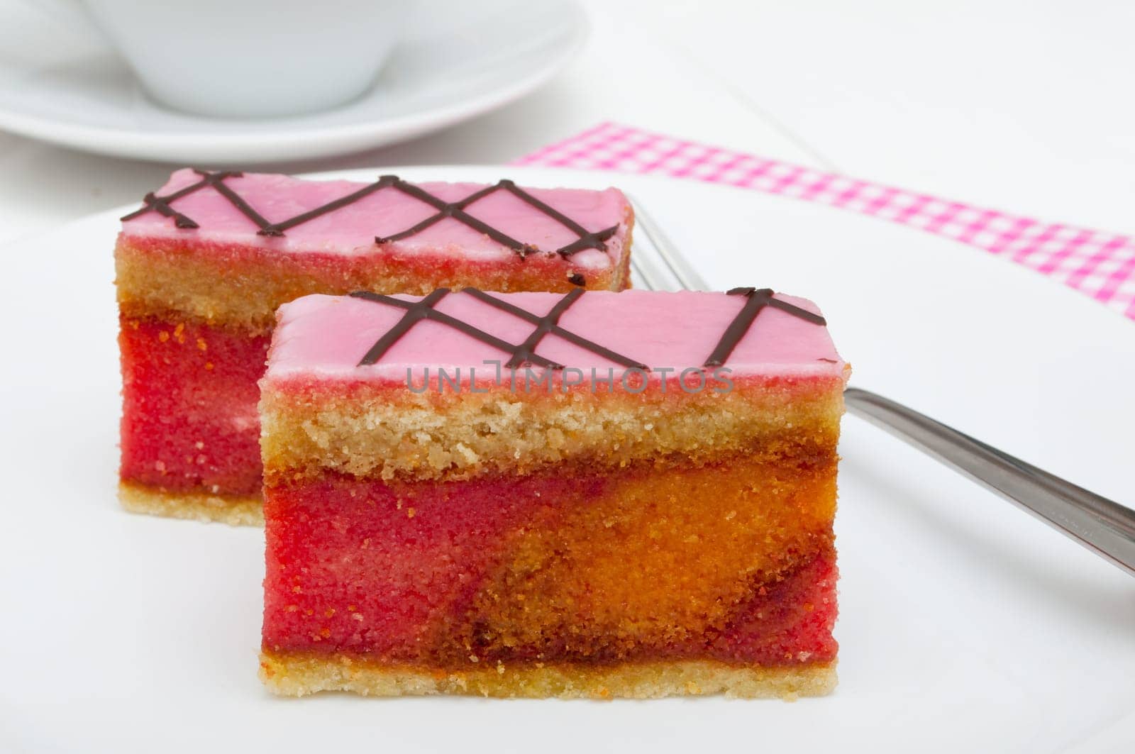 Punch Cake - Sweet Dessert on White Plate on Table