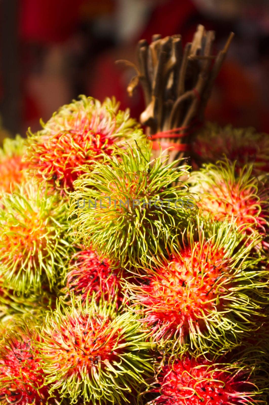 rambutan fruits on sale in asia street, exotic tropical fruit.