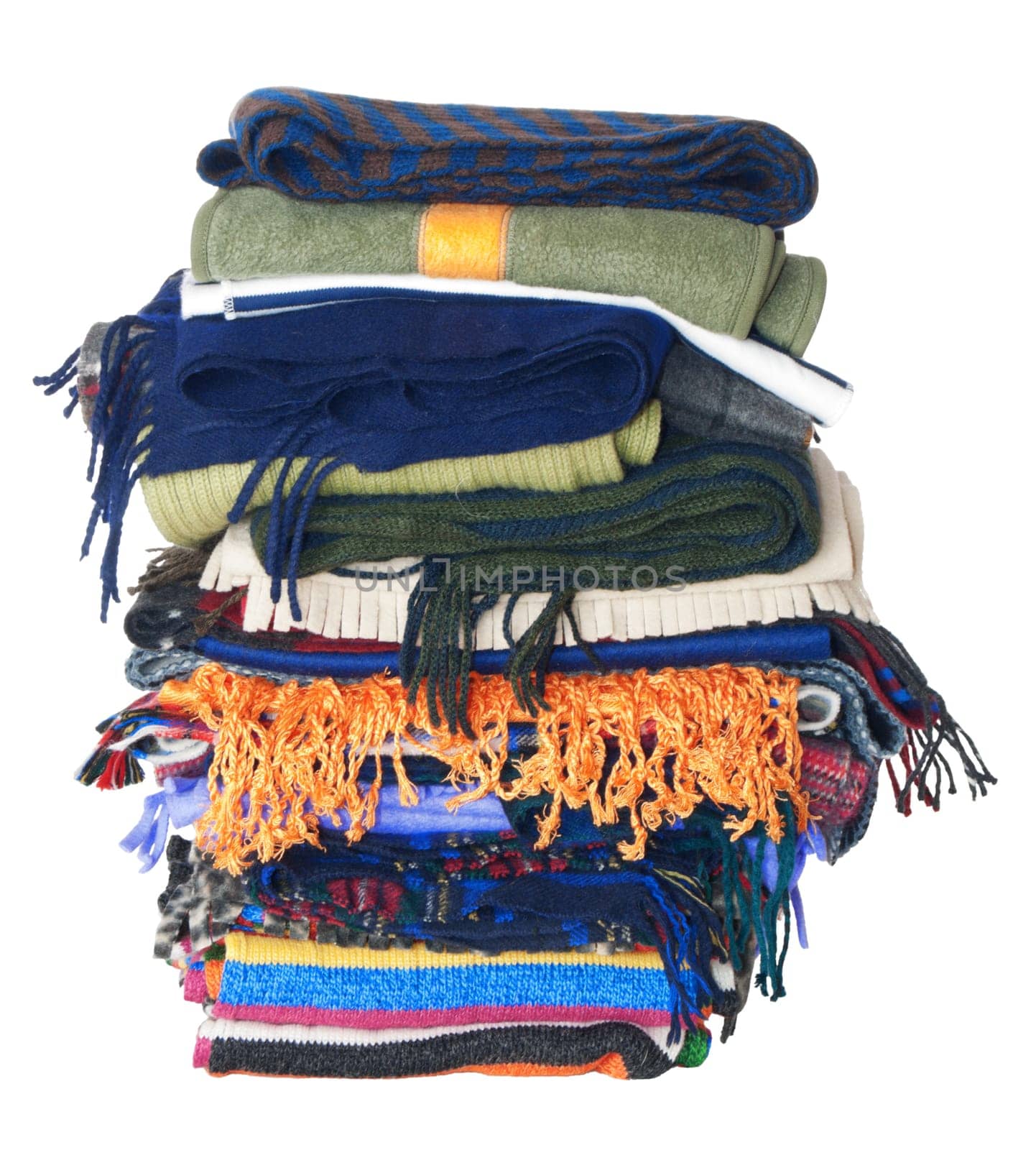 Pile of winter woollen scarfs. Isolated on white background
