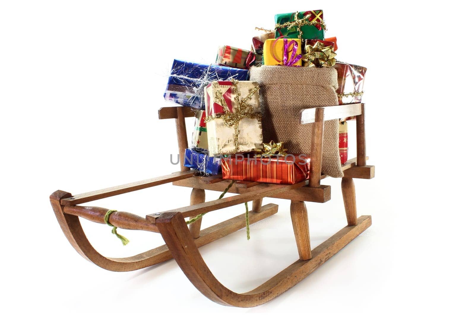 a sleigh with many colourful Christmas gifts