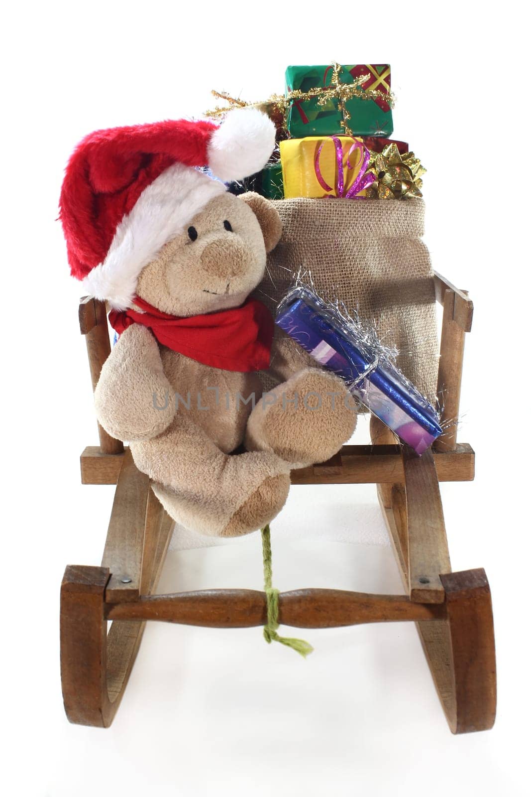 a teddy bear with many colorful Christmas gifts