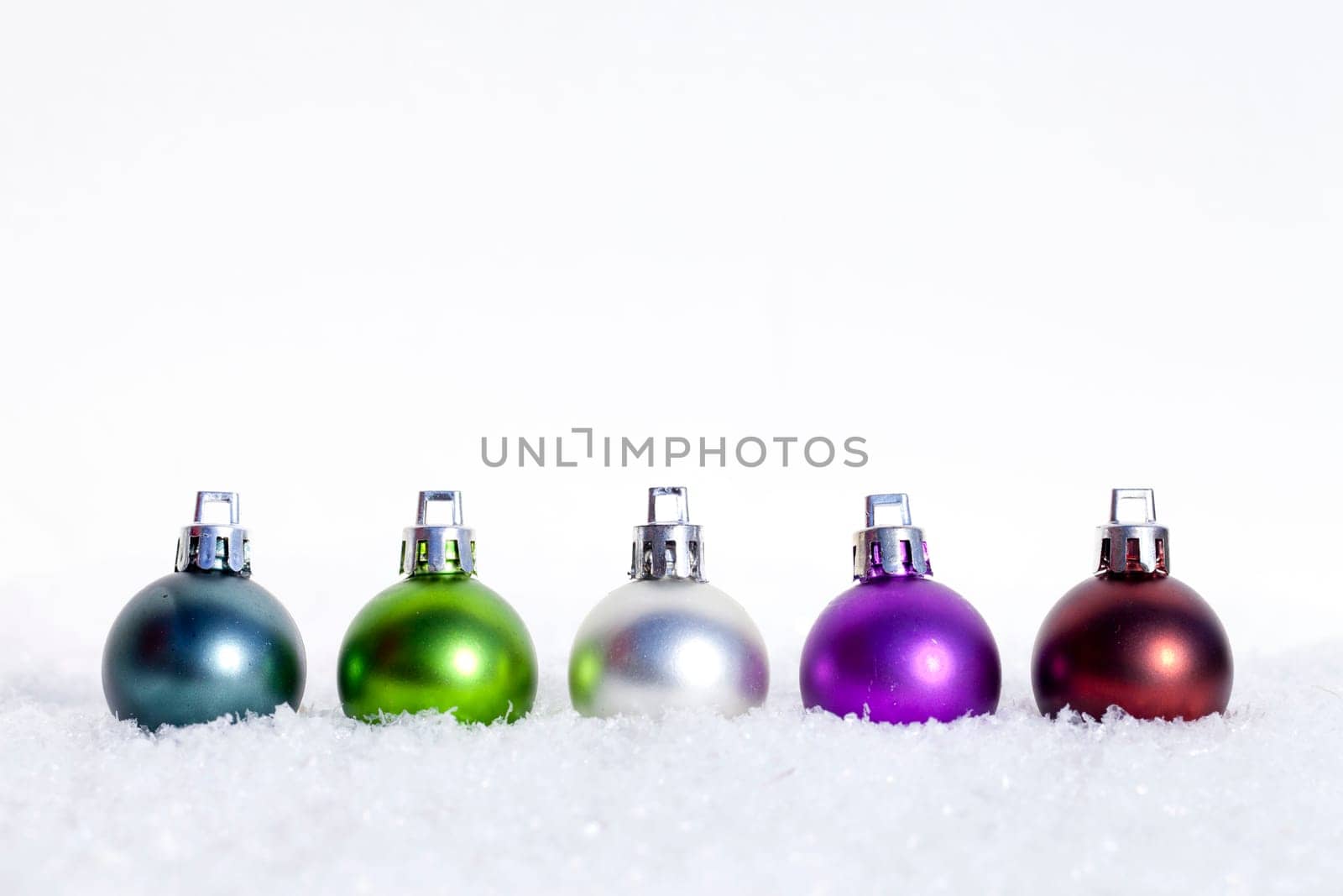 Christmas baubles in the snow