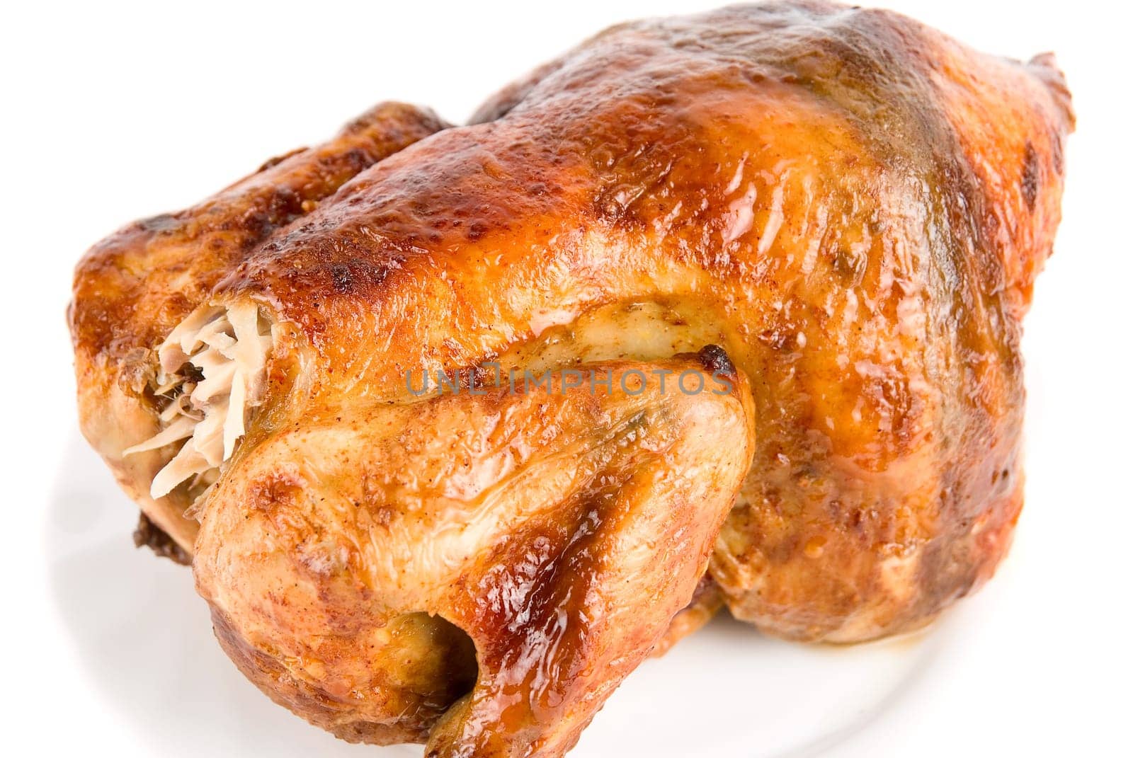 Close up of Tasty Crispy Roast Chicken on white plate