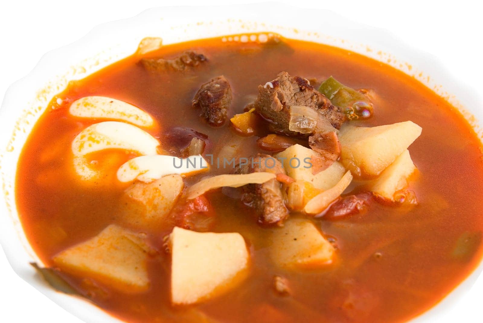 Close up of borscht soup in white isolated on white background