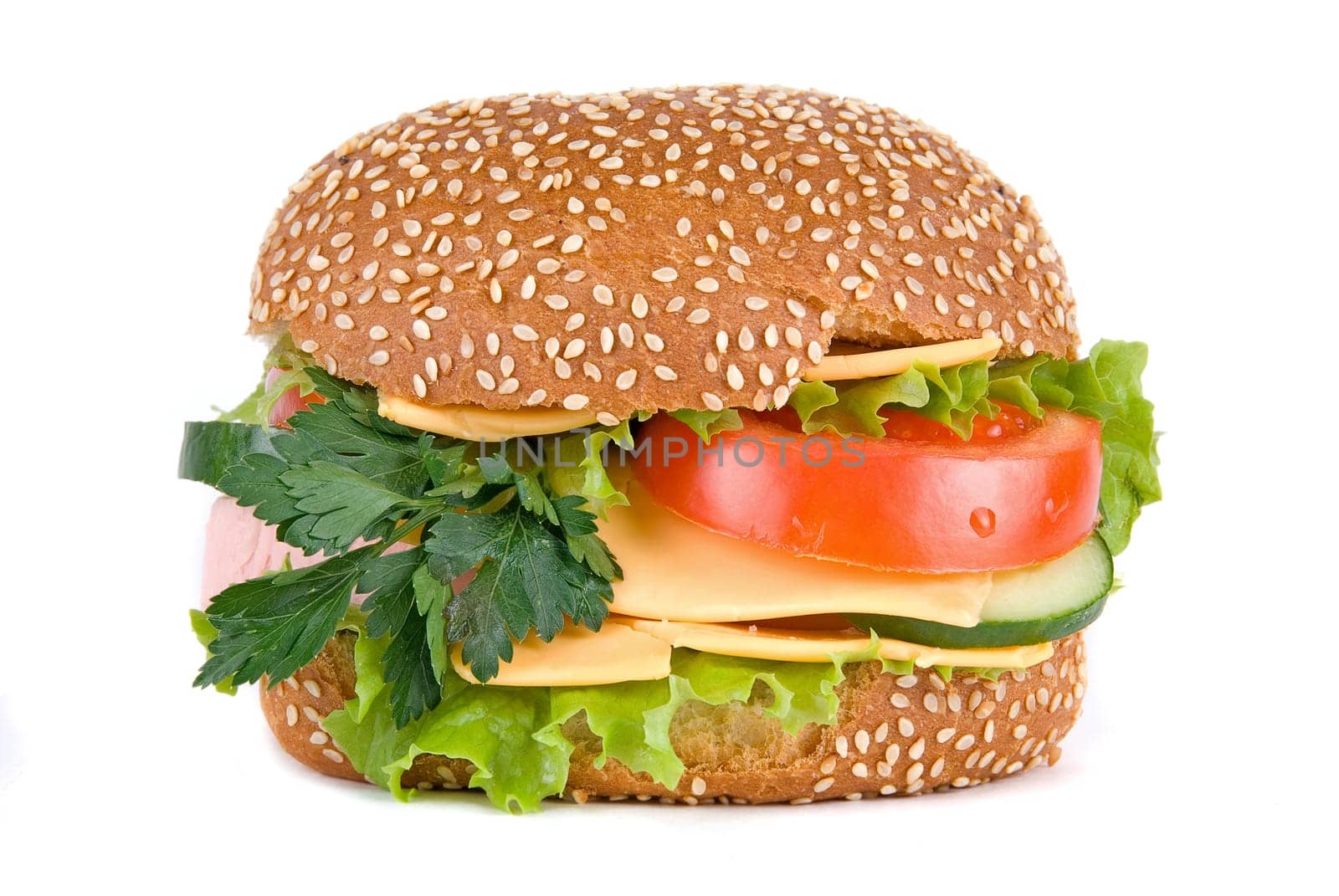 Hamburger with cheese tomatoes cucumbers and lettuce isolated on white