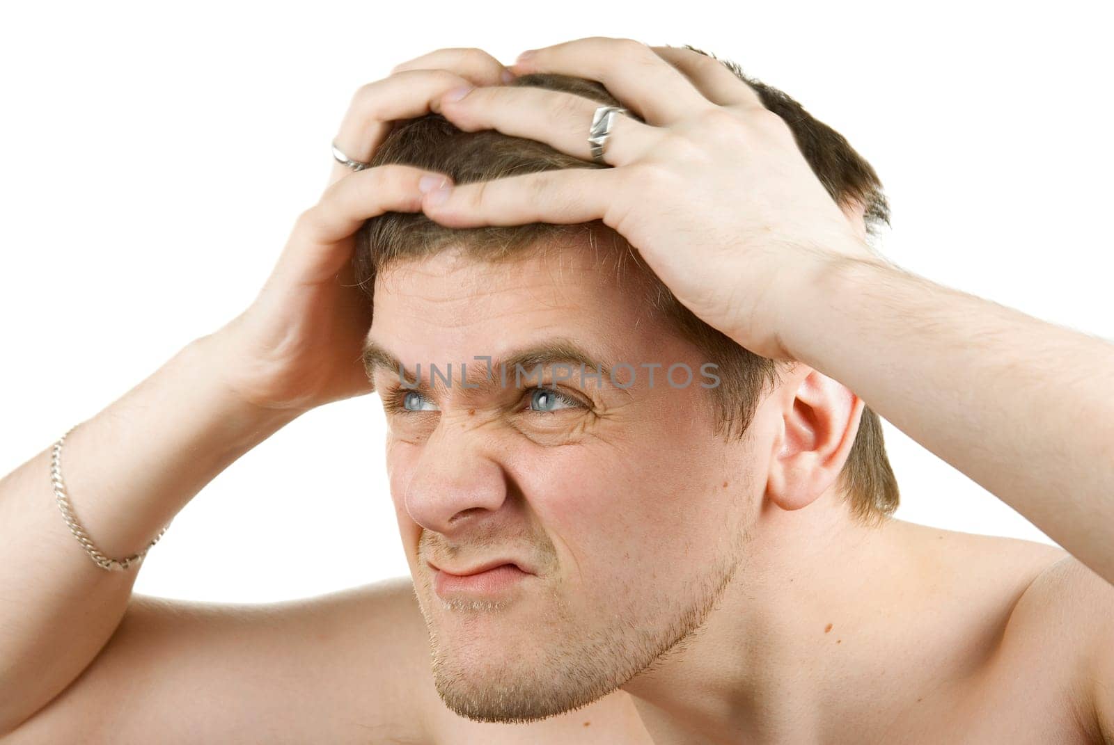Portrait of a young man in pain on white