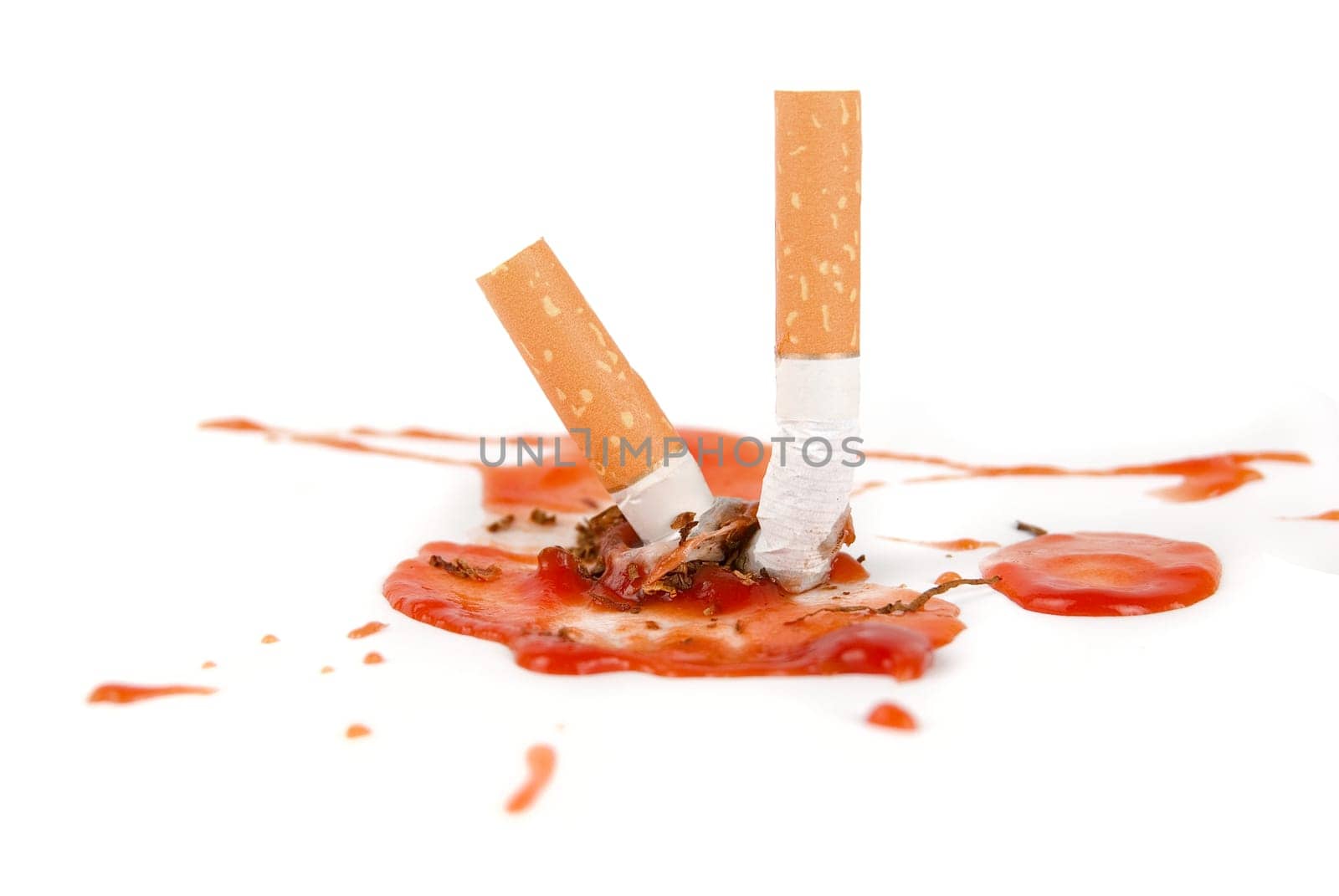 smoking kills concept. cigarettes with blood isolated on white.