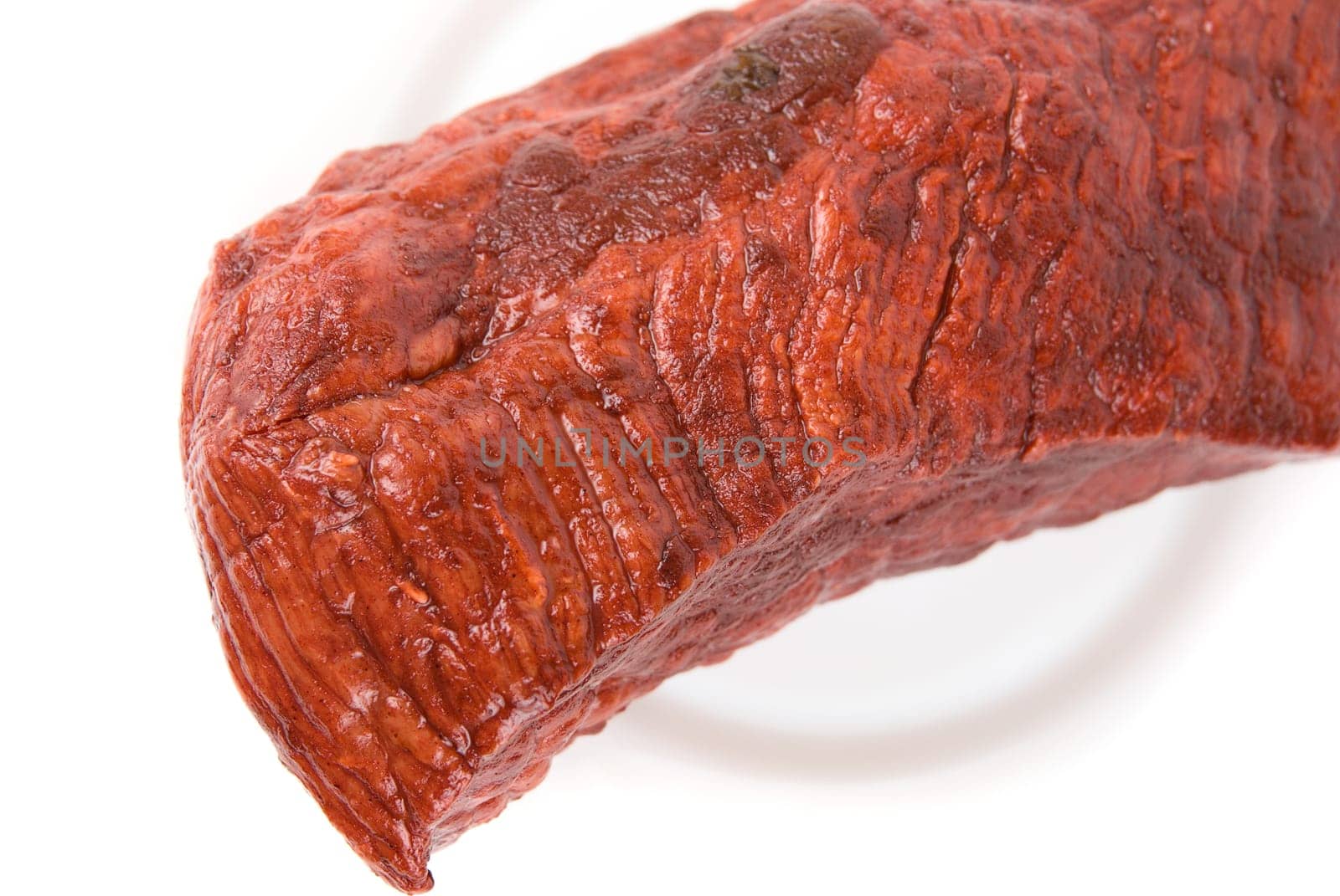 Close-up of beef&#039 s piece on plate isolated on white