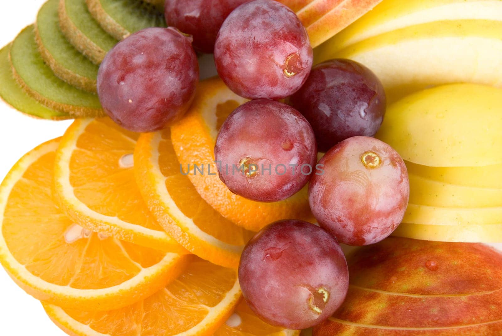 Healthy fresh fruits background with orange, kiwi, grapes and apple