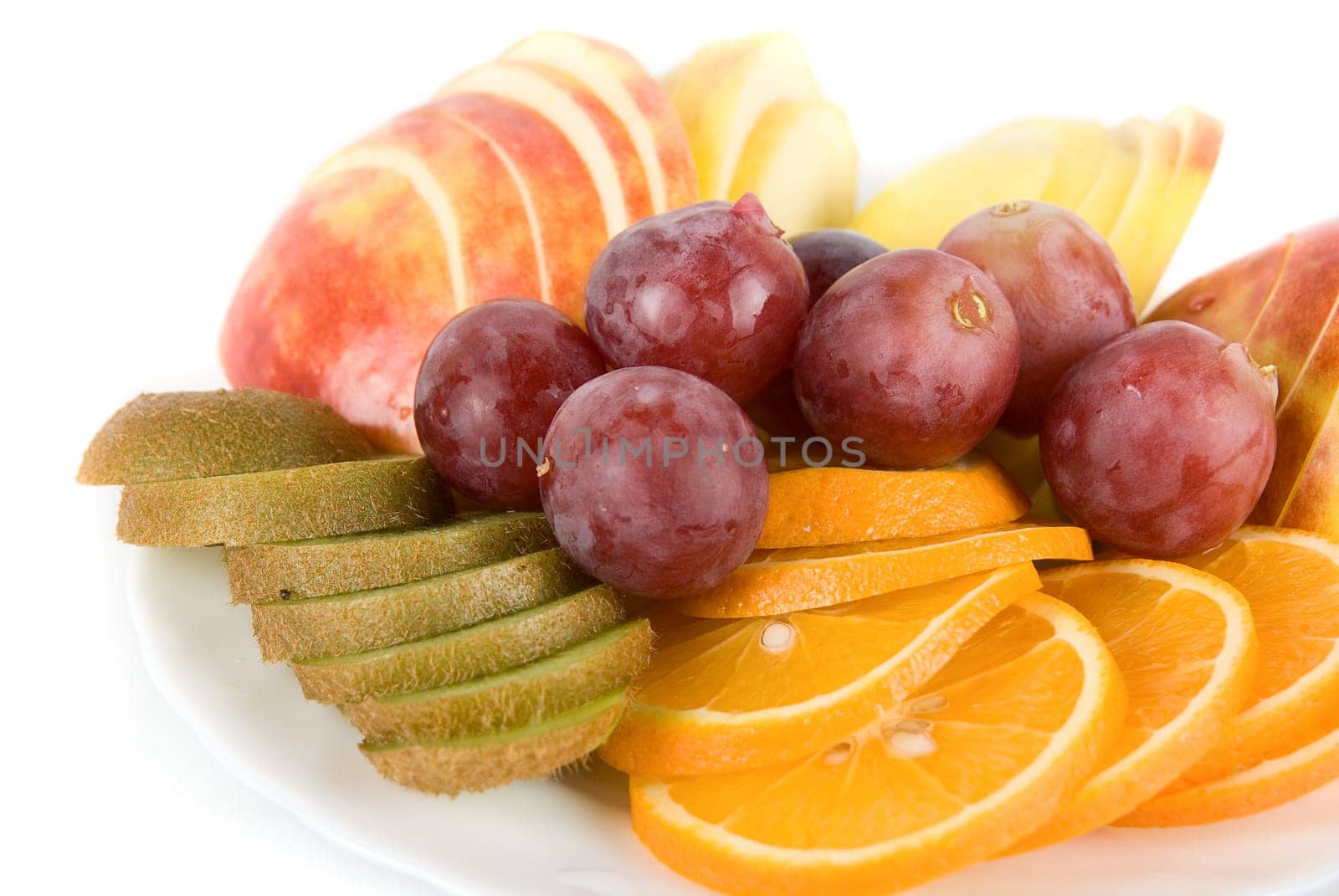 Healthy combination of fresh fruits with orange, kiwi, grapes and apple