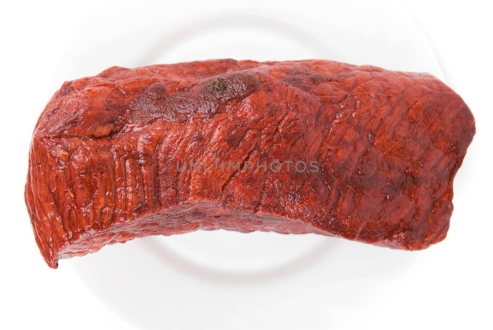 Piece of a beef on plate isolated on white