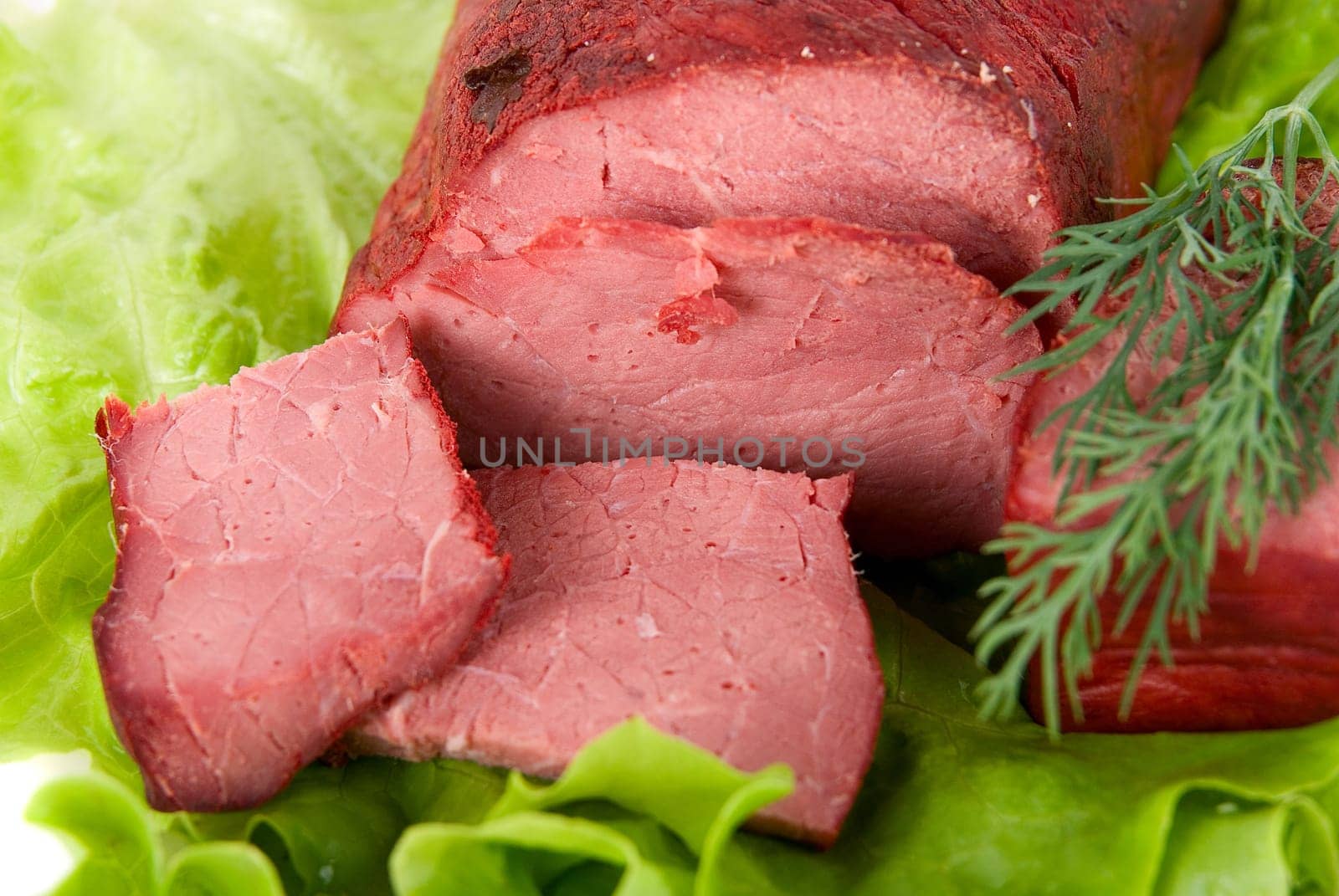 Close up of fresh lettuce and beef meat isolated on white