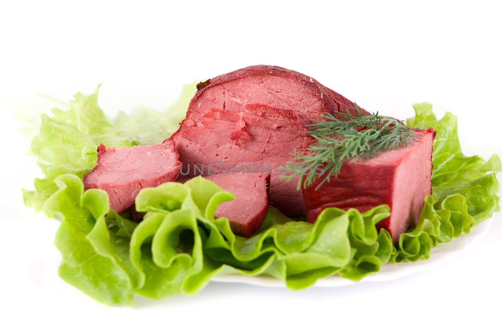Healthy beef meat on lettuce background