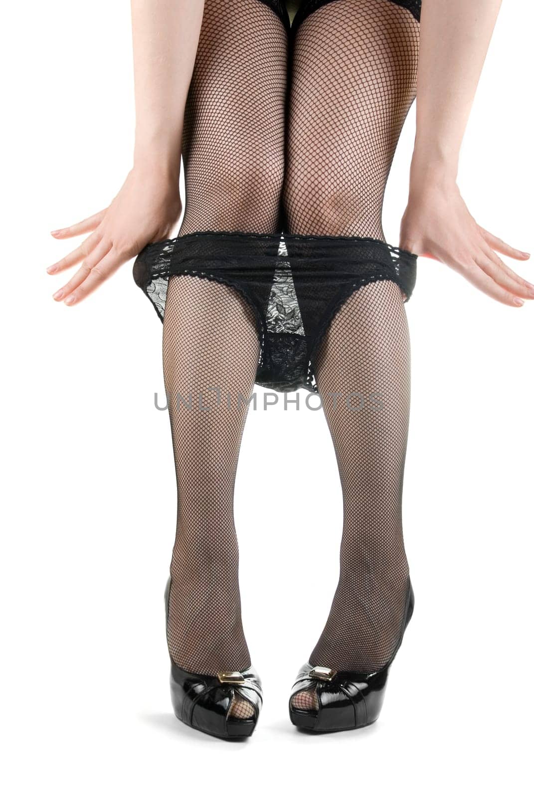 female legs with black panties, black stockings and in black shoes
