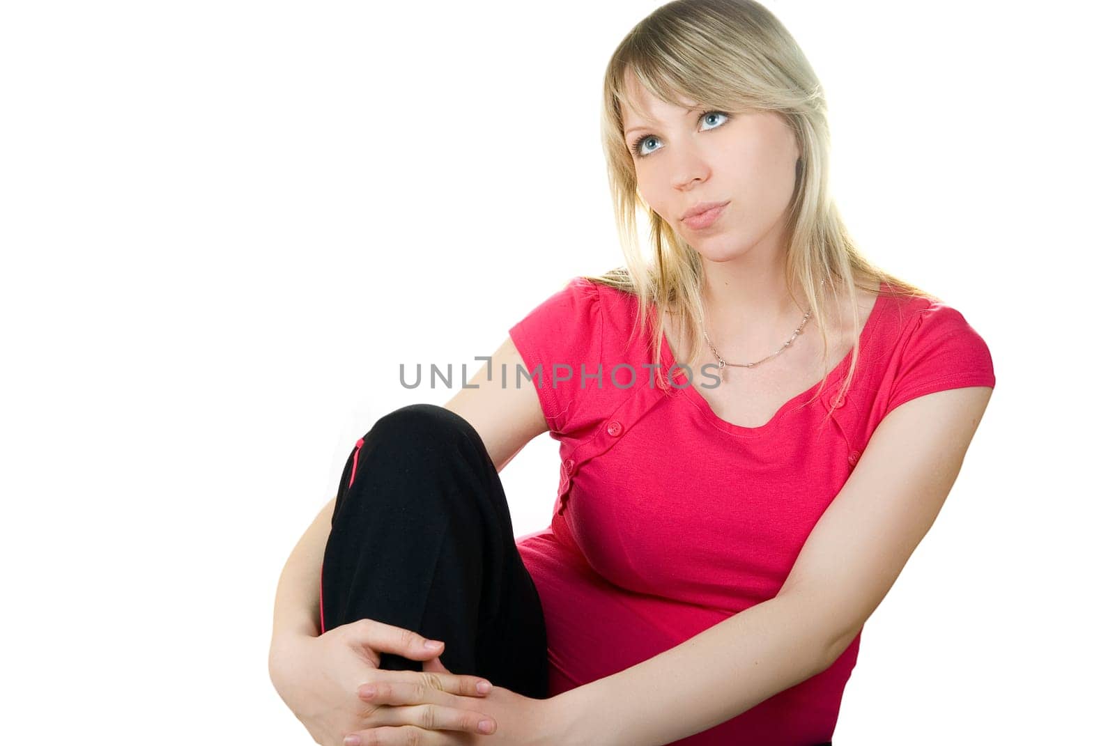 portrait of the beautiful blond sitting woman