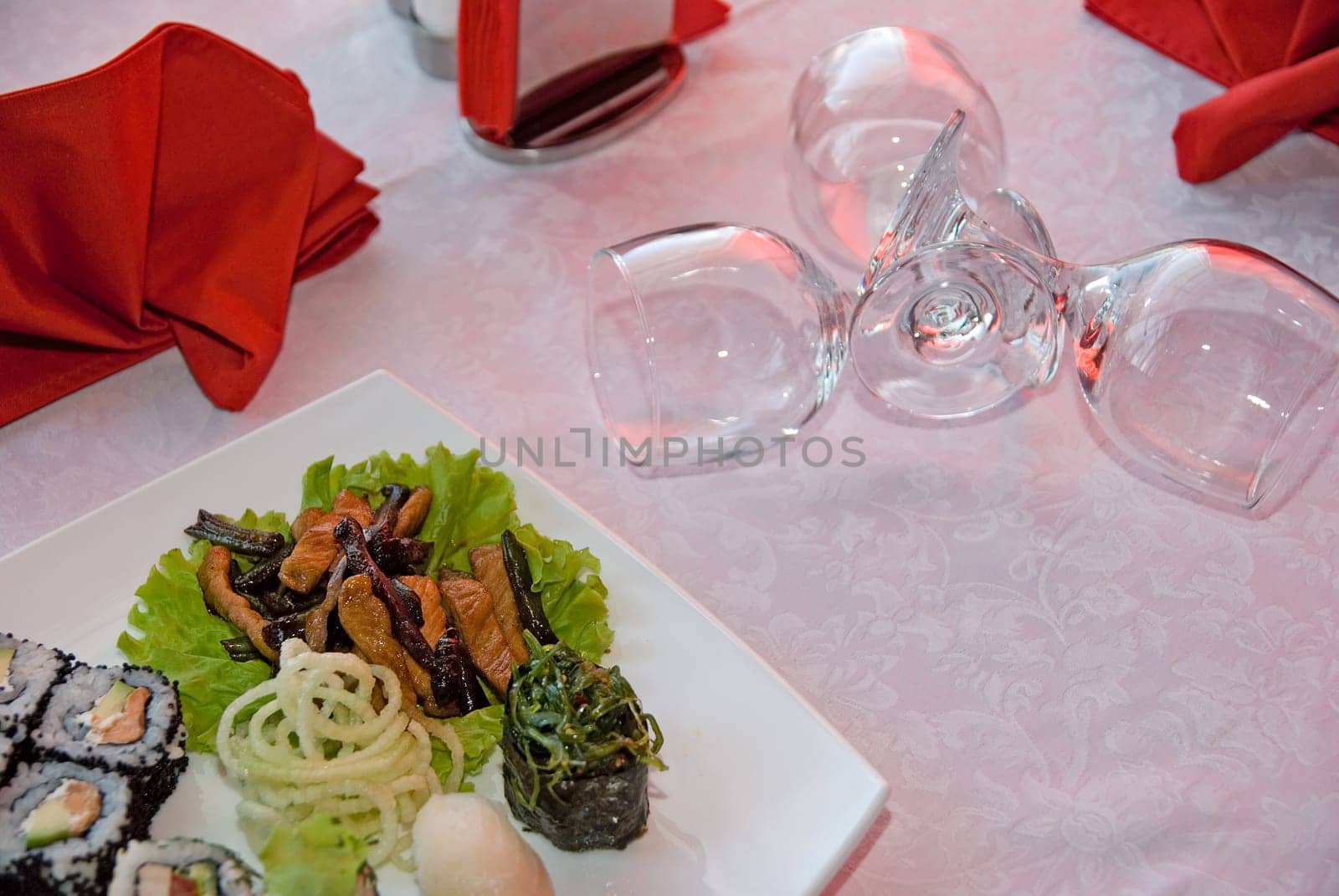 sushi set plate and vine glass on the table