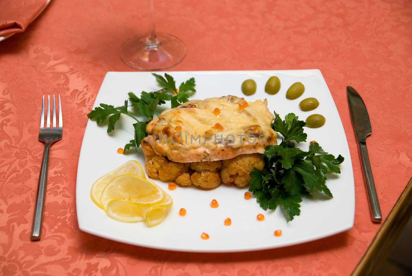 Restaurant tasty trout fish dish at table