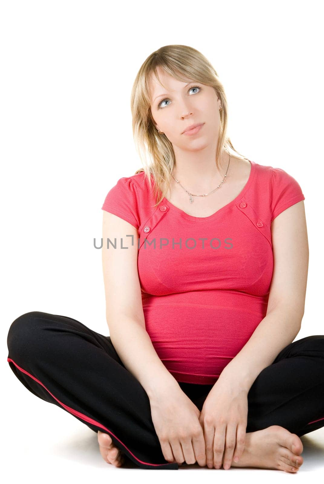 Pregnant sitting woman isolated on white background