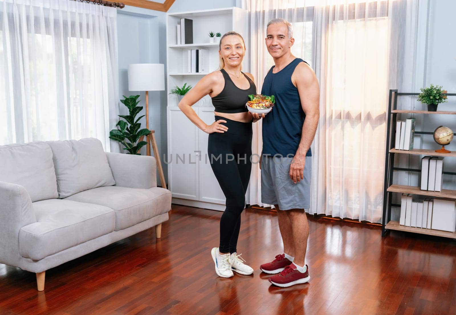 Healthy senior couple in sportswear taking selfie with vegan food. Clout by biancoblue