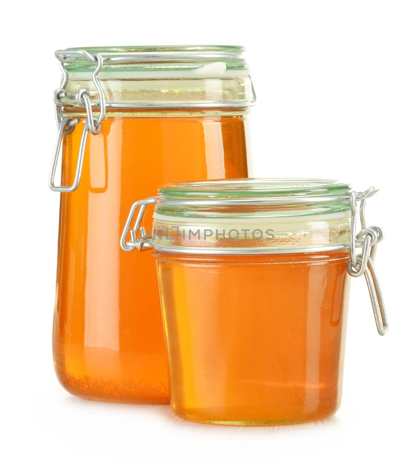 Jars of honey isolated on white