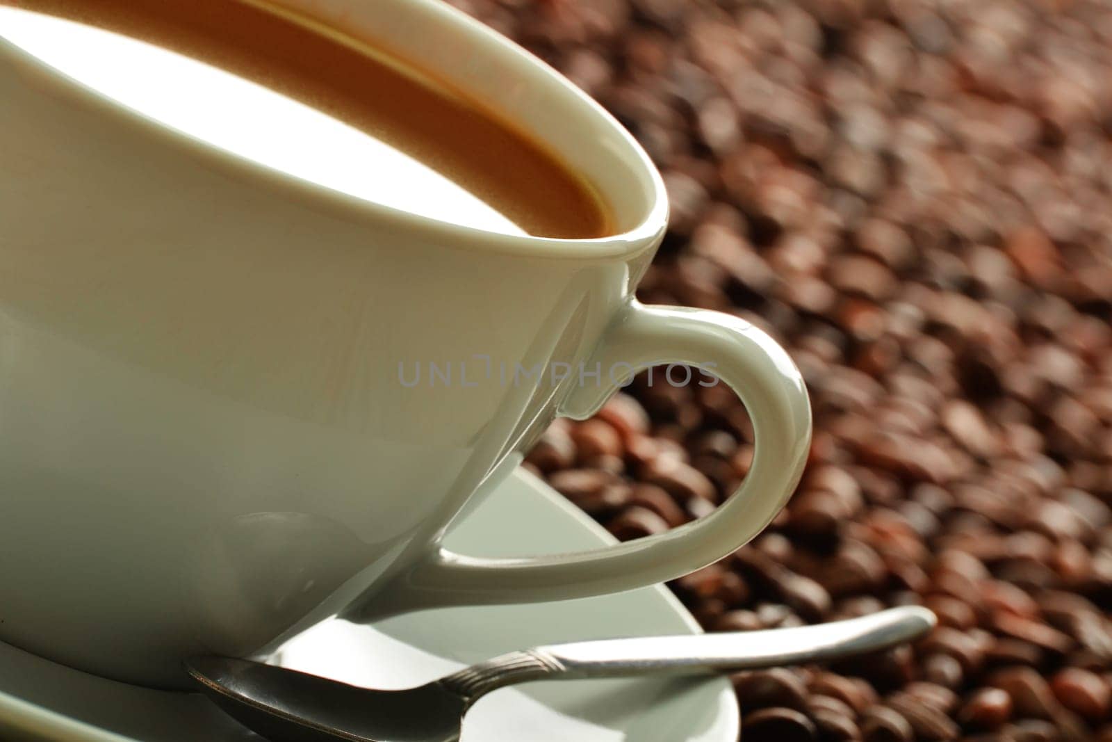 Composition with cup and coffee beans