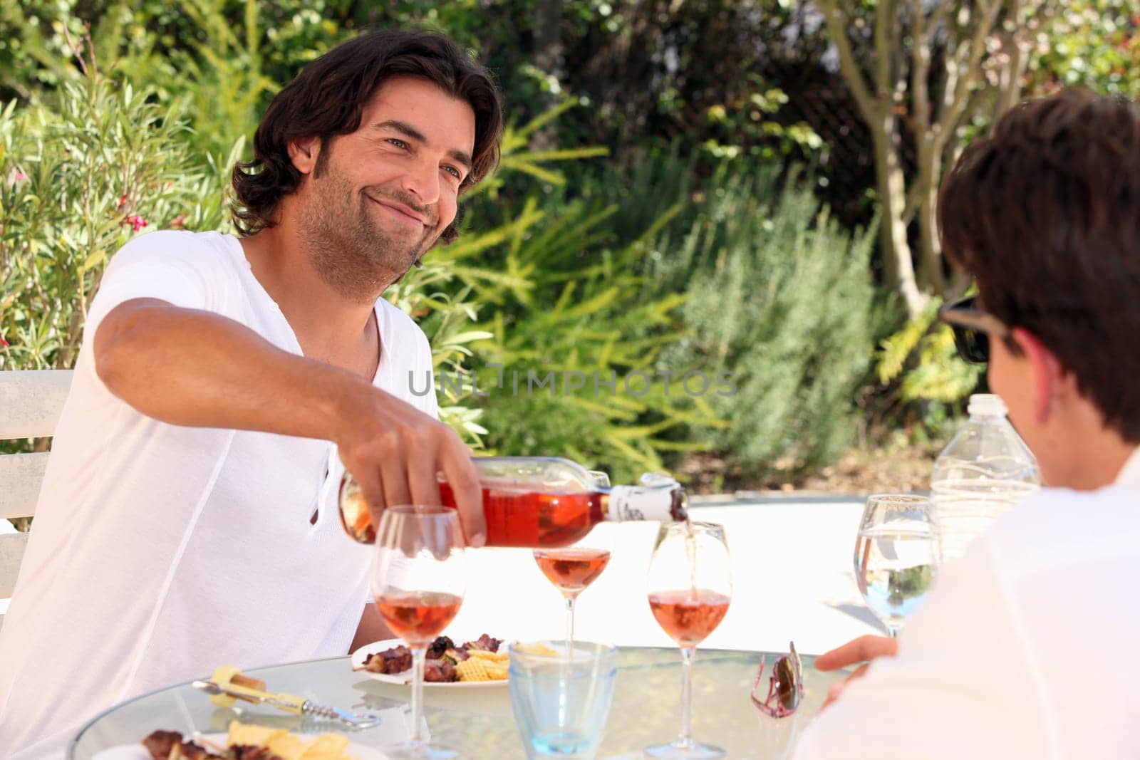 Friends drinking wine outdoors