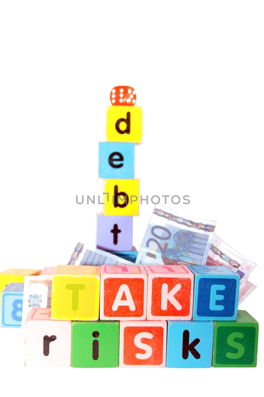 assorted childrens toy letter building blocks against a white background that spell take risks and debt