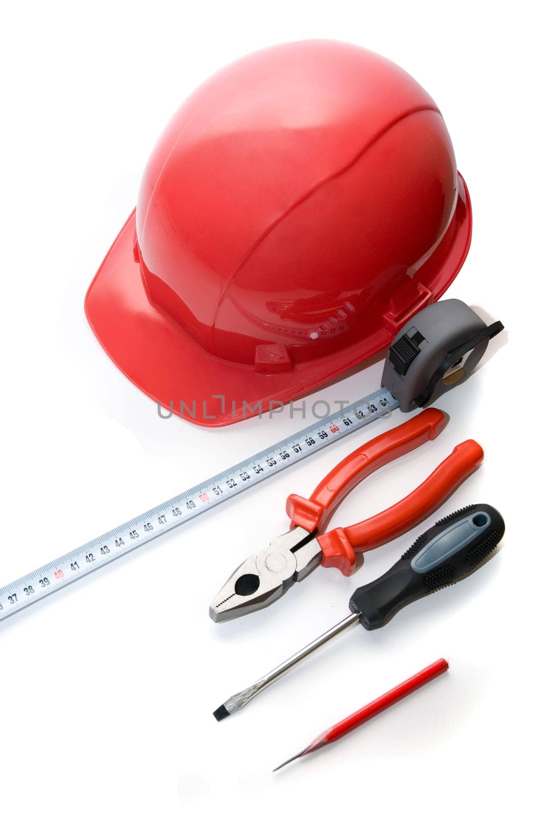 Safety helmet, measuring tape and other tools isolated on white