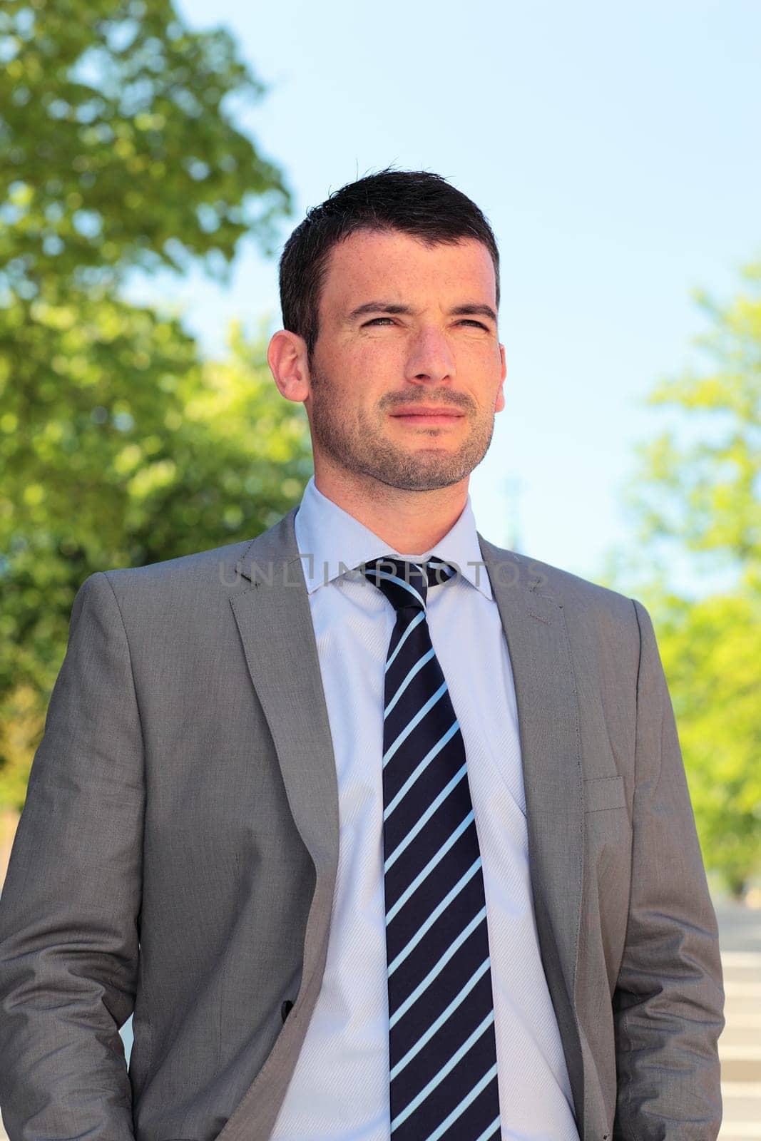 standing handsome man waiting outdoor in autumn