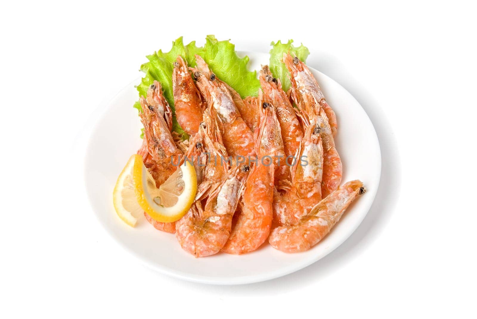 tasty shrimp with lemon and lettuce isolated on a white