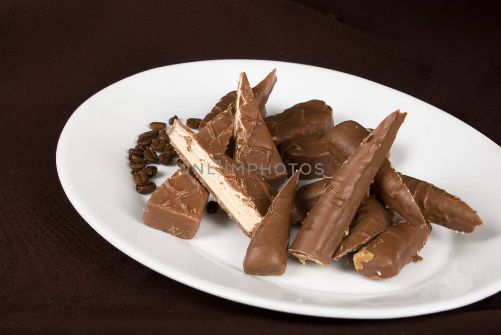 chocolate plate on the dark brown background