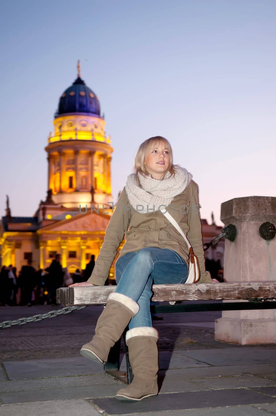 Young woman in the city in the evening