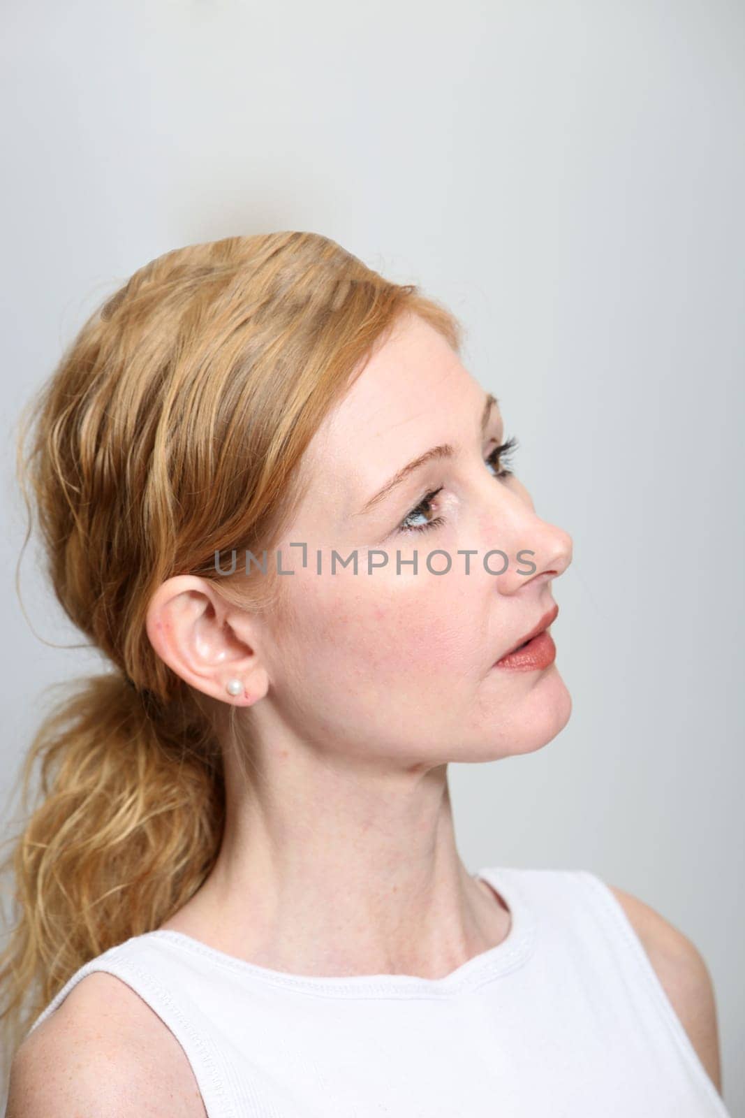 Young woman looking to the right - vertically