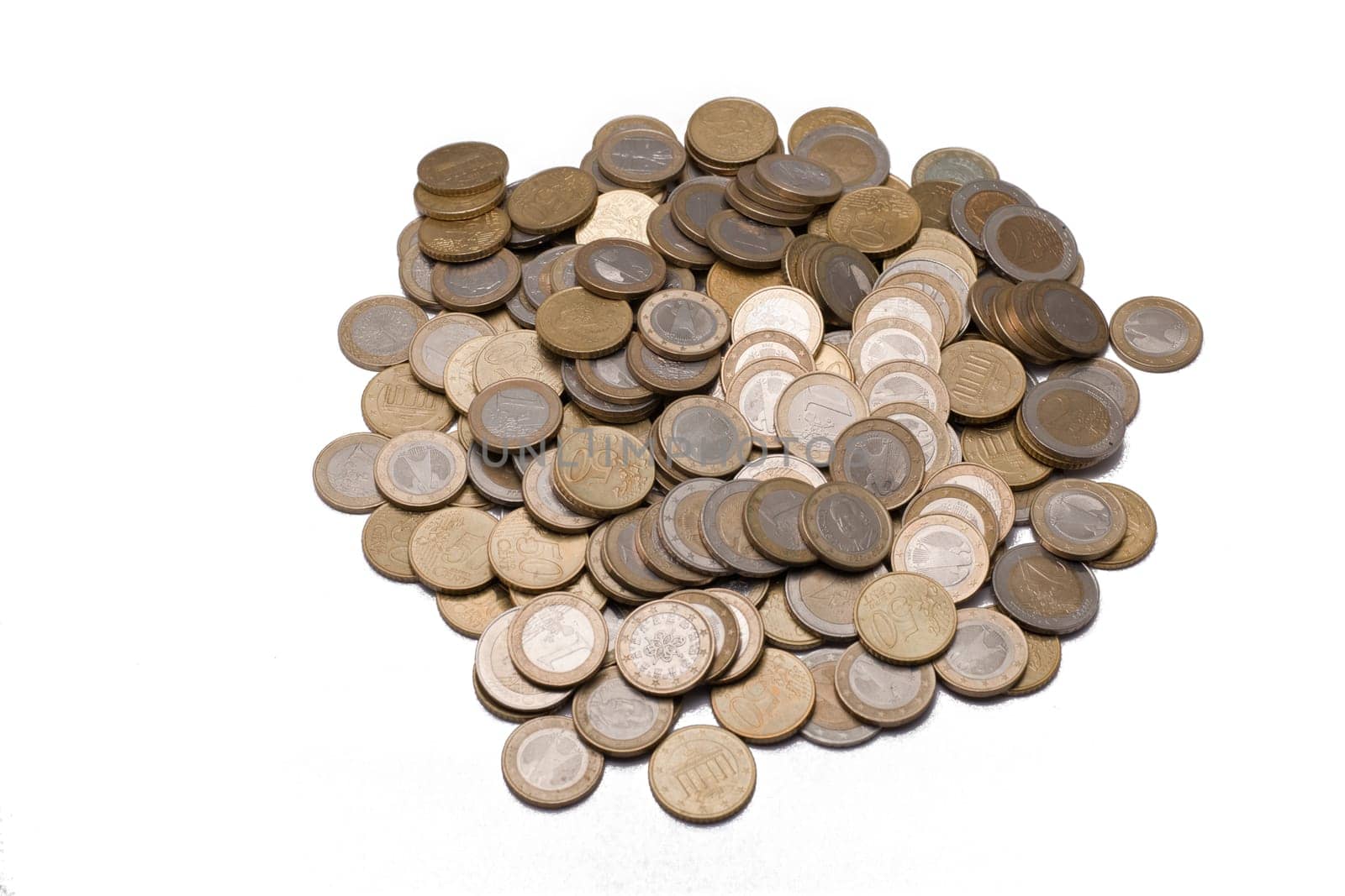 Many euro coins on white background