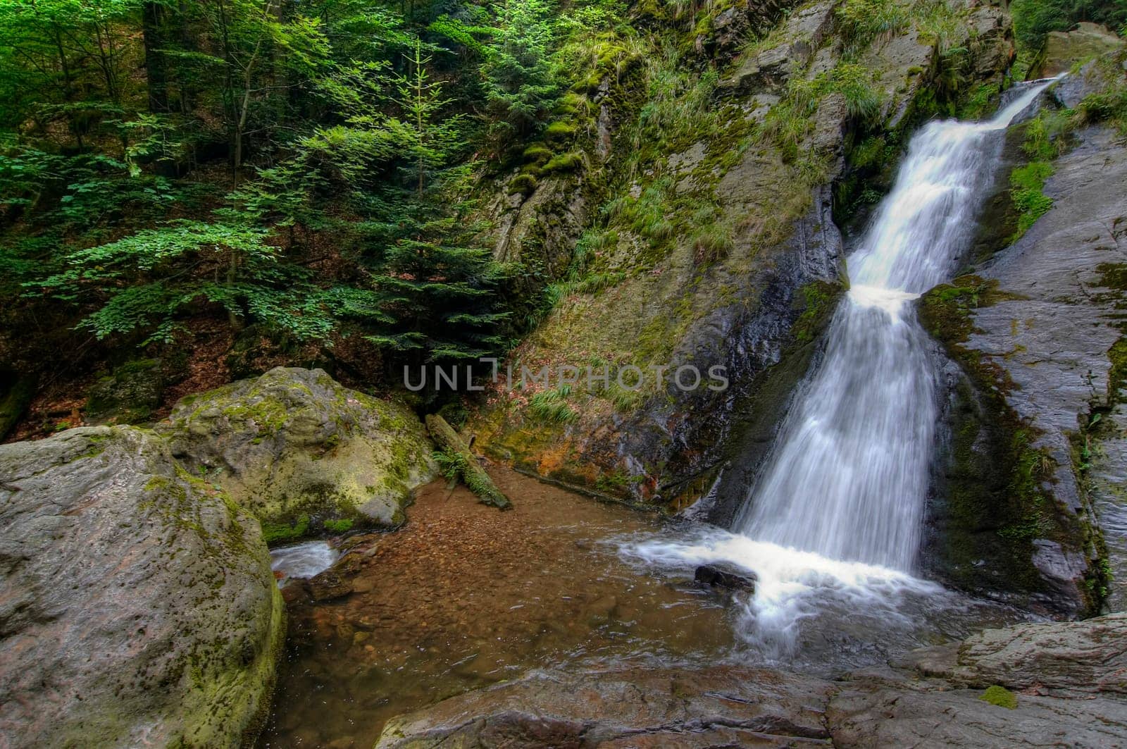 Shot of the fall of water. Stream Huntava - natural area - nature preserve. Resov, Czech republic, Europe.