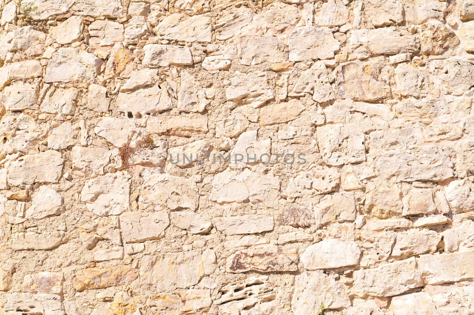 Detail of a stone wall with different size of rock.
