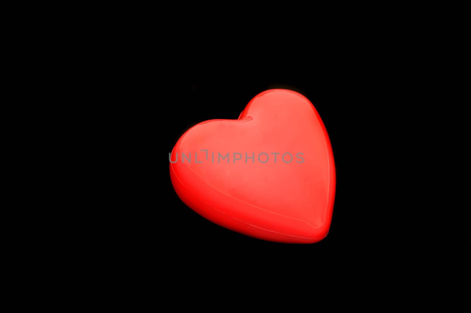 Red heart isolated on a dark back ground