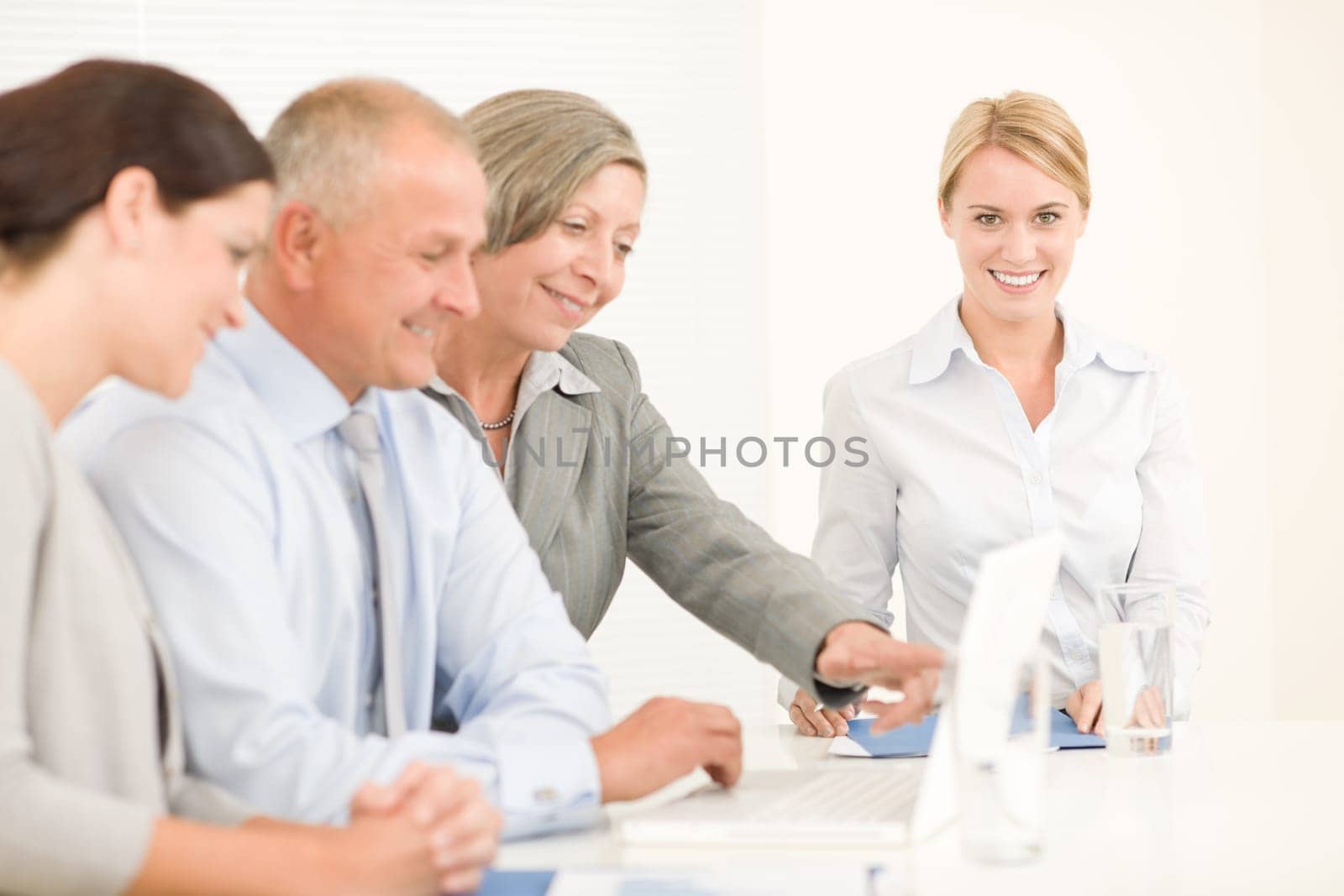 Business team attractive businesswomen with happy colleagues working around table